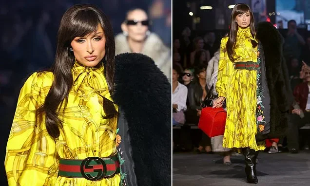 Reality TV star looks unrecognizable as she storms the Gucci runway in a brunette wig with bangs - 1