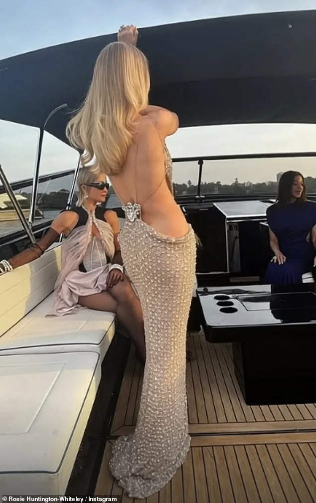 Rosie Huntington-Whiteley stuns in a backless gold gown as she enjoys a lavish yacht trip and 'majestic' Vogue ball at the Sydney Opera House - 1