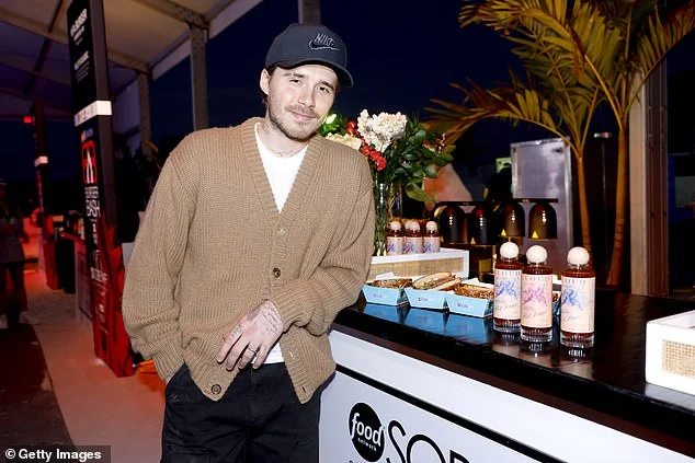 Brooklyn Beckham covers up his arms as he promotes his hot sauce range at food festival - after he was spotted wearing a £220k watch gifted by his dad David - 3