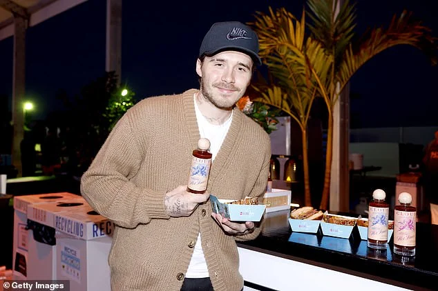 Brooklyn Beckham covers up his arms as he promotes his hot sauce range at food festival - after he was spotted wearing a £220k watch gifted by his dad David - 4