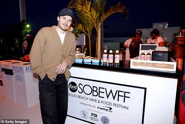 Brooklyn Beckham covers up his arms as he promotes his hot sauce range at food festival - after he was spotted wearing a £220k watch gifted by his dad David - 1