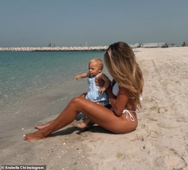 Arabella Chi poses in a bikini with baby daughter Gigi as she shares carefree snaps from Dubai while expats rush to flee the Gulf state amid 'rising panic' - 4