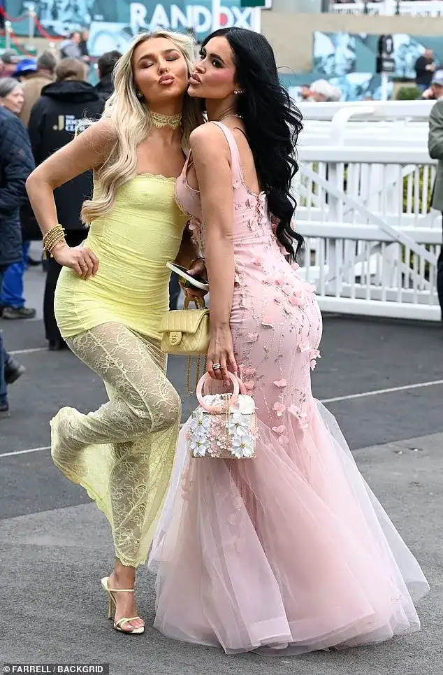 Here come the girls! Glamorous Aintree revellers don daring frocks to kick off the Grand National festival in style - 2