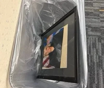 Pam portrait thrown in trash... - 1