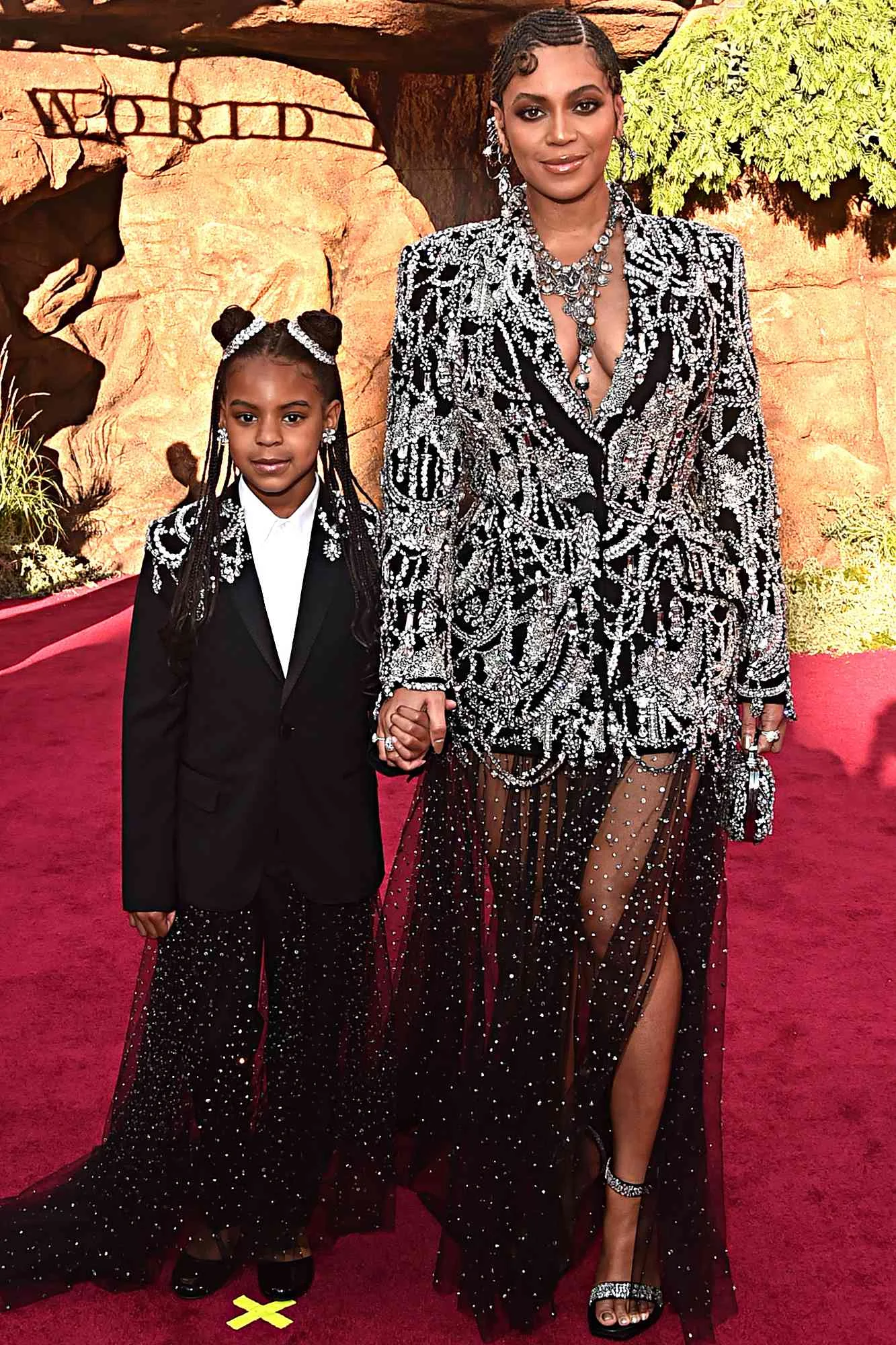 Blue Ivy, 14, recreates her annual jumping picture on the field as she attends the Super Bowl with her dad and rarely-seen sister Rumi, eight - 2