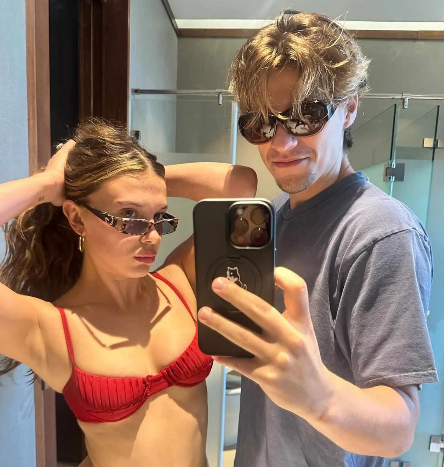 Millie Bobby Brown forces a smile with Jake Bongiovi on her 22nd birthday months after welcoming first child - 3