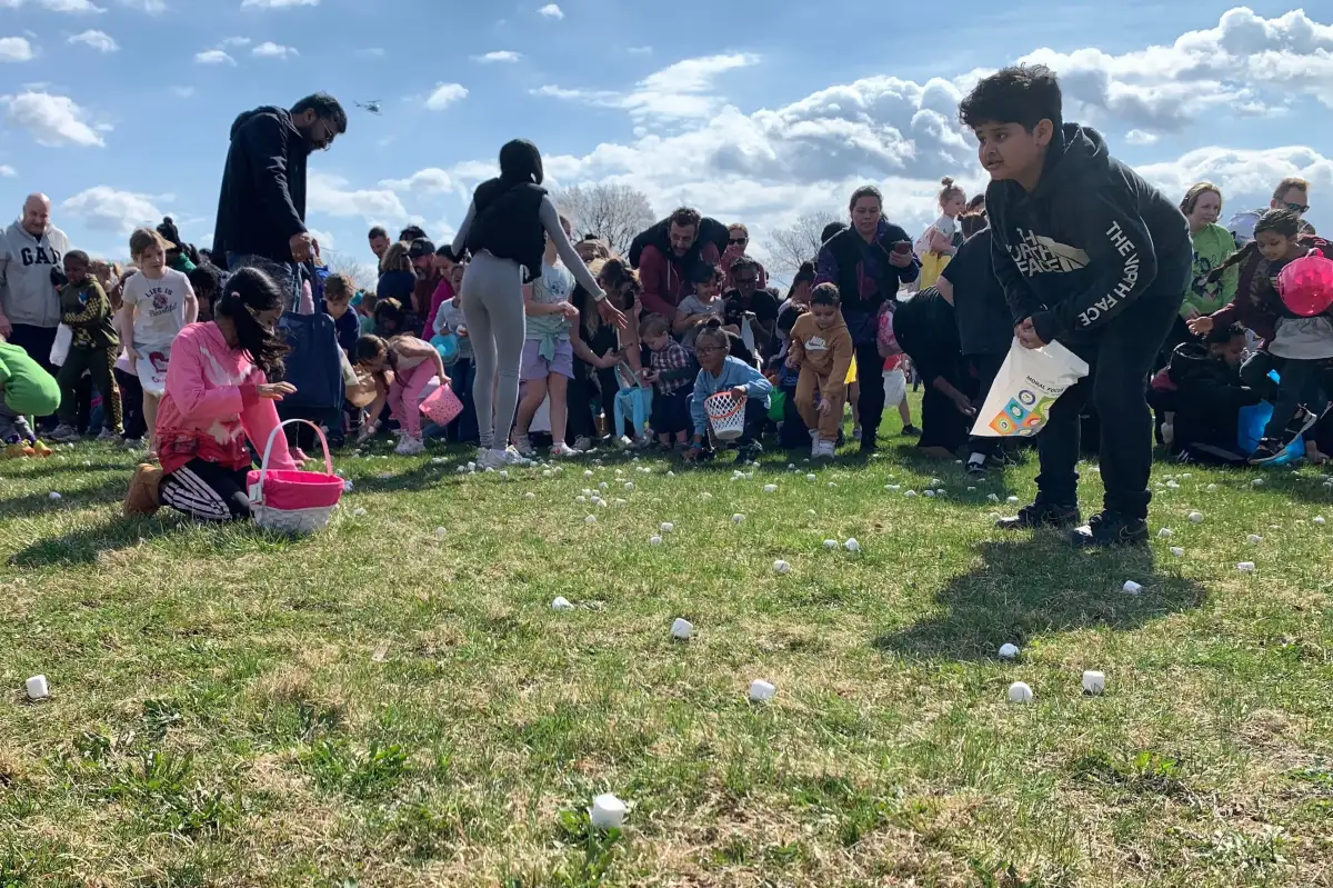 Children race to gather marshmallows dropped from a helicopter at pair of Michigan parks - 1