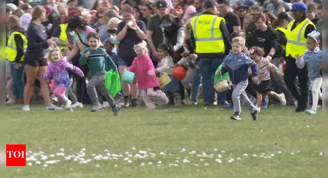Children race to gather marshmallows dropped from a helicopter at pair of Michigan parks - 4